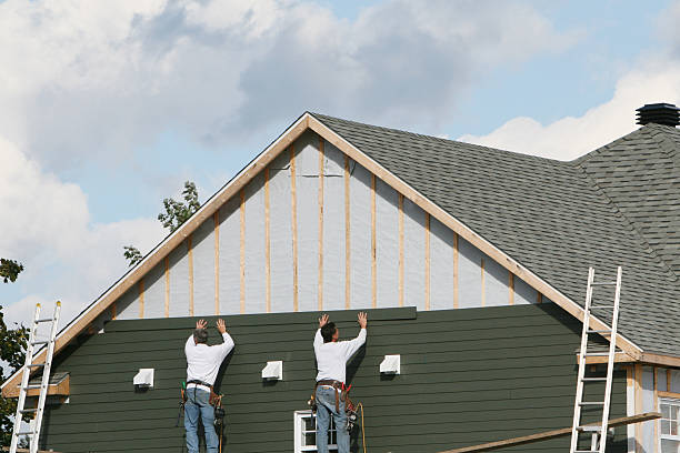Professional Siding Installation technician working in Manns Choice, PA